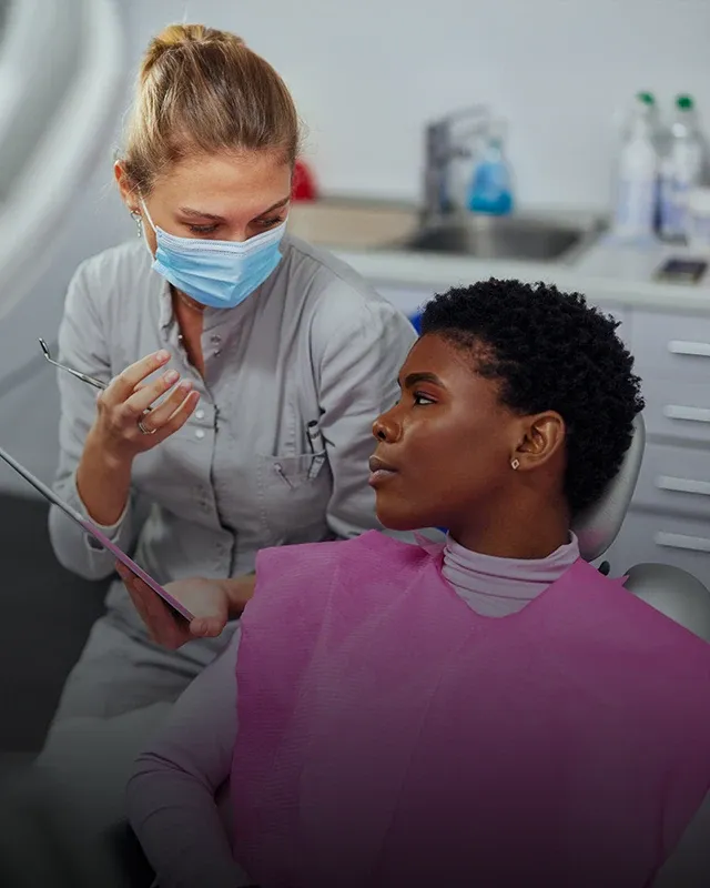 A patient and dental professional having a consultation during an appointment